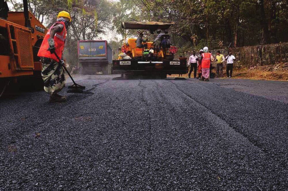 Road construction crew and equipment on site